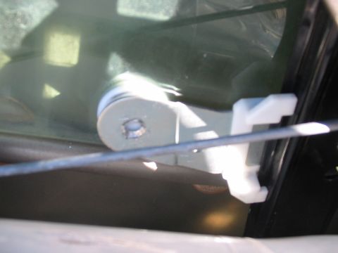 2003 Ford Crown Victoria - Close-up of a car door's internal latch mechanism.