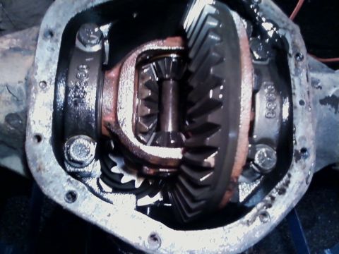 1990 Ford Bronco - Differential housing with the cover removed, looking straight in at the ring gear, open carrier with spider and side gears, pinion gear tee…