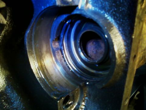 1990 Ford Bronco - A detailed view of a rusty metal component, highlighting its internal spiral structure and metallic sheen.
