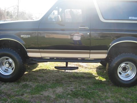 1994 Ford Bronco - A 1994 Ford Bronco is shown from the side, running boards and BFGoodrich tires.