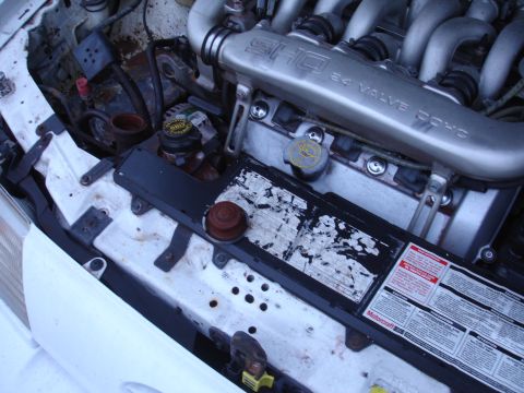 1989 Ford Taurus - Engine bay detail showing the intake manifold of a Ford SHO 3.0L 24 valve DOHC engine.
