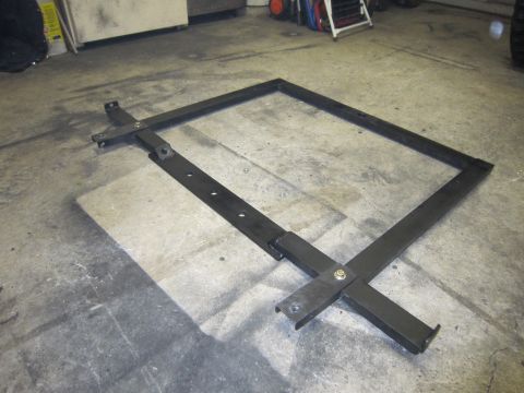 1996 Ford Bronco - Adjustable metal frame with mounting points, possibly for a spare tire carrier.