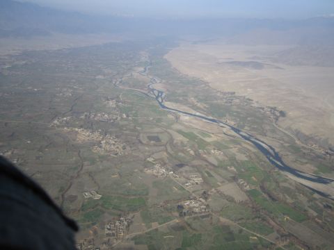 2003 Jeep Wrangler - An aerial perspective captures a vast river valley, dotted with farms and villages, stretching towards distant mountains.