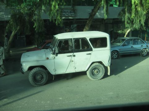 2003 Jeep Wrangler - UAZ-452 van seen on the road with another car in the background.