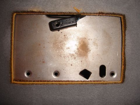 1992 Ford Explorer - Close-up of an interior car part, possibly a bracket or mounting plate, with visible text 'WAR 82584-M'.