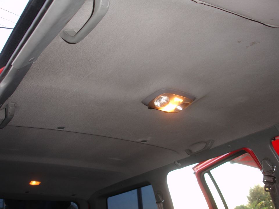 Interior ceiling with lights and grab handles