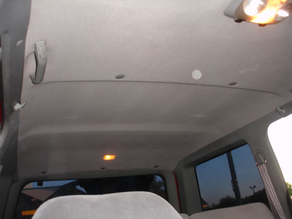 1992 Ford Explorer interior ceiling with dome lights and grab handles visible