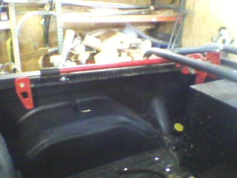 1975 Chevrolet Blazer - hi-lift jack base holder incorporated into the tire rack, and held by wing-nut on bed rail armor
