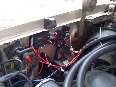 1992 Ford Bronco - The engine bay shows a complex wiring setup with a fuse box and various electrical components.