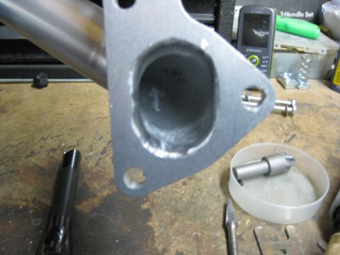 1993 Honda Civic - Close-up of an exhaust manifold flange, showing the mounting points and the opening for the exhaust pipe.