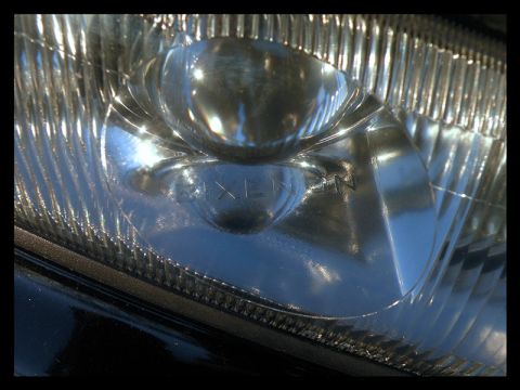1998 Subaru Legacy - Headlight detail showing 'KOITO' branding, not a 1998 Subaru Legacy.