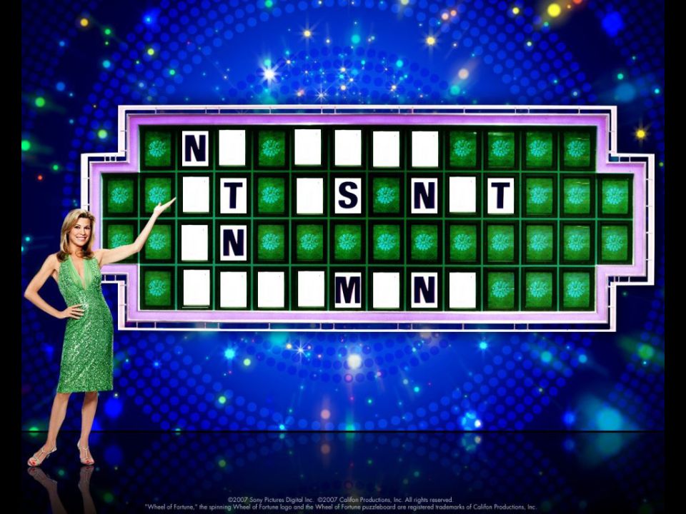 Woman in green dress points to Wheel of Fortune puzzle board with letters N, T, S, M visible