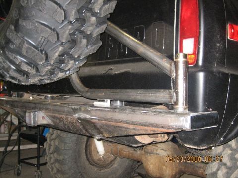 1967 Ford Mustang - Custom rear bumper and spare tire carrier assembly on a black truck.
