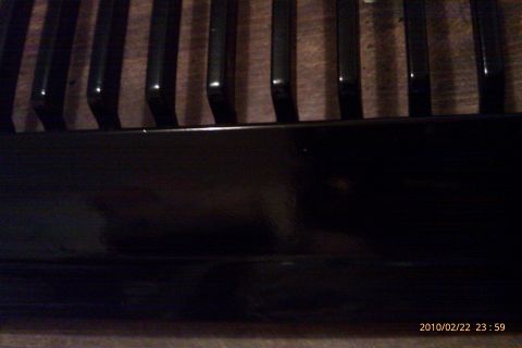 2000 Mercury Grand Marquis - Close-up view of a black grille, likely a vehicle part.