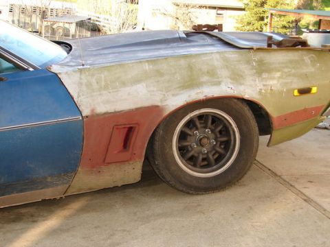 1971 Ford Ranchero - This vehicle is undergoing bodywork, with primer visible on the fender and rear quarter panel.