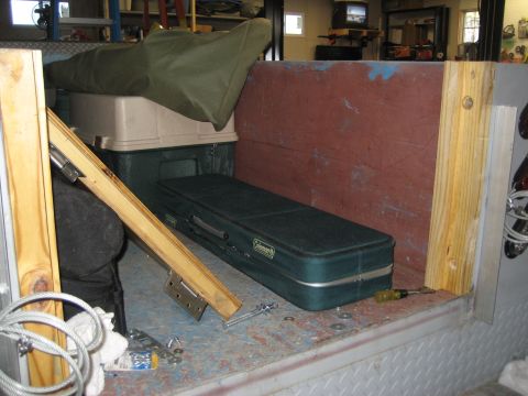 1996 Ford Bronco - Storage items are visible inside the cargo area of a vehicle.