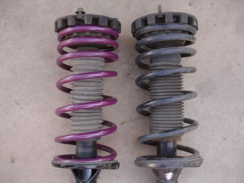 1995 Ford Taurus - Two car suspension struts are shown side-by-side for comparison.