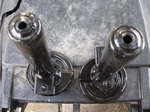 1995 Ford Taurus - Pair of black painted suspension components shown from a top-down perspective.