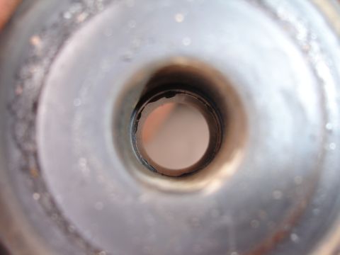 1995 Ford Taurus - The interior of a metal tube shows wear and tear, with no visible vehicle identification.