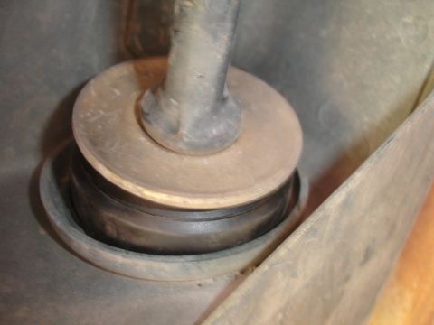 1995 Ford Taurus - A close-up view of a rubber bushing and metal rod, likely a suspension component, is shown in detail.