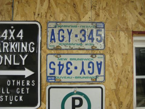 1999 Ford Crown Victoria - Two New Brunswick license plates are displayed, one with the registration AGY-345 and the other appearing reversed.