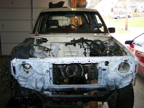 1988 Suzuki Samurai - This Toyota pickup truck is undergoing some engine bay work, with the engine completely removed.