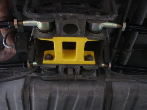 1995 Ford Taurus - Aftermarket yellow brace installed on the rear suspension assembly.