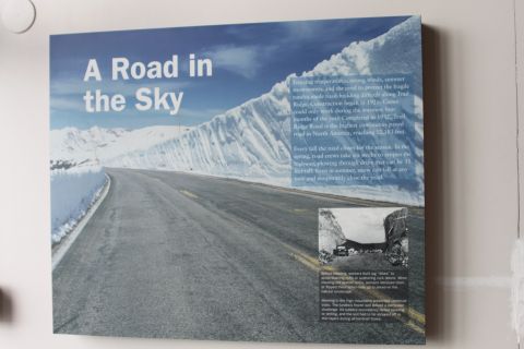 2003 Jeep Wrangler - Photo of an interpretive park placard titled 'A Road in the Sky' describing Trail Ridge Road, not a vehicle document.