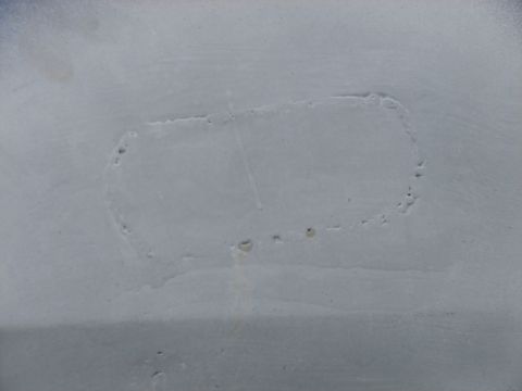 1973 Ford Ranchero - The faint outline of an emblem suggests a missing badge on this light gray surface.