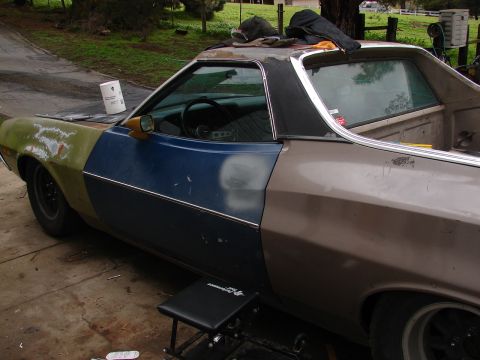 1973 Ford Ranchero - This Ford Ranchero is in a state of repair, showing various paint colors and primer on its body panels.