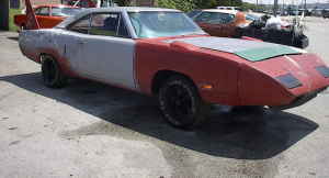 1991 Ford Bronco - This 1970 Plymouth Superbird is in the process of being restored, showing primer and red paint.