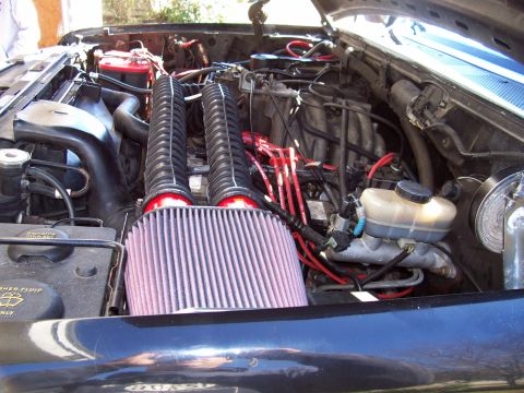 1994 Ford Bronco - Engine bay of a 1994 Ford Bronco with dual aftermarket air intake system installed.