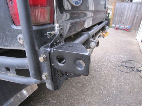 1996 Ford Bronco - Close-up of the rear bumper and hitch receiver on a Ford Bronco, showing custom modifications.
