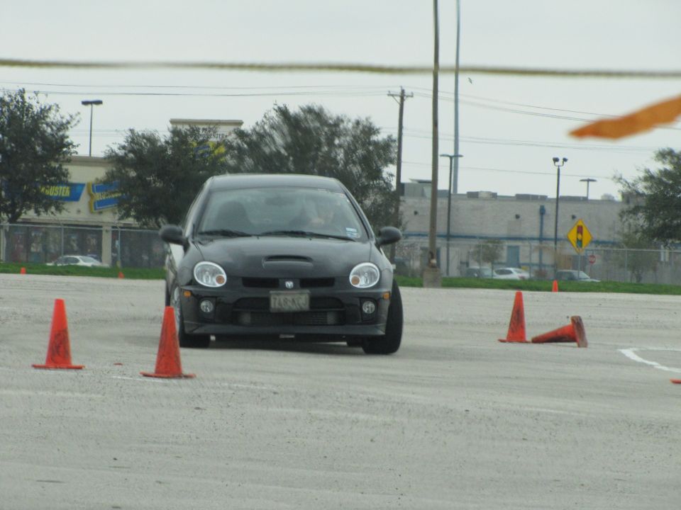 Black Dodge Neon SRT-4 with hood scoop and racing cones