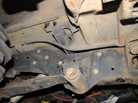 1995 Ford Bronco - Close-up of the underbody structure, showing frame and suspension parts. Supermotors.net logo is present.
