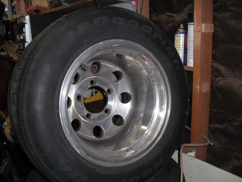 1991 Ford Bronco - A close-up view of a chrome alloy wheel with a BFGoodrich tire mounted on it.