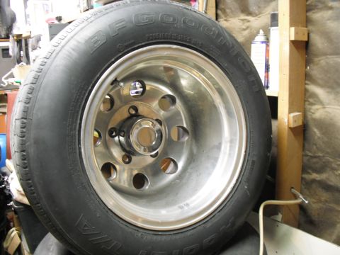 1991 Ford Bronco - Close-up of a BFGoodrich tire and chrome wheel, likely a spare or replacement part.