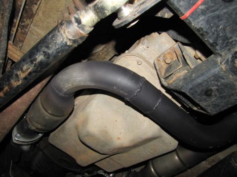 1995 Ford Bronco - Underside view shows exhaust pipe and transmission components.