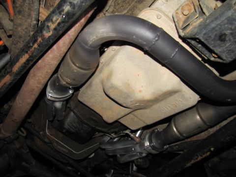 1995 Ford Bronco - The photo shows the underside of a vehicle, focusing on the exhaust system components.