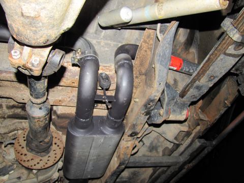 1995 Ford Bronco - Underside view shows the exhaust system and suspension components of a vehicle.