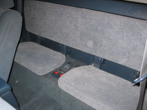1990 Toyota Pickup/SR5 - Rear interior view of a truck, showing the seats and floor area. The registry claims it is a 1990 Toyota Pickup/SR5.