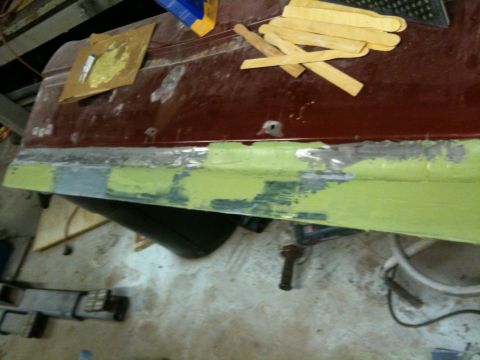 1993 Ford Bronco - Bodywork on a car door, showing primer and filler application.