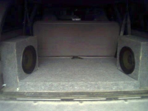1994 Ford Bronco - Here is the floor covering/amp boxes. Cap mounted on back right speaker box.