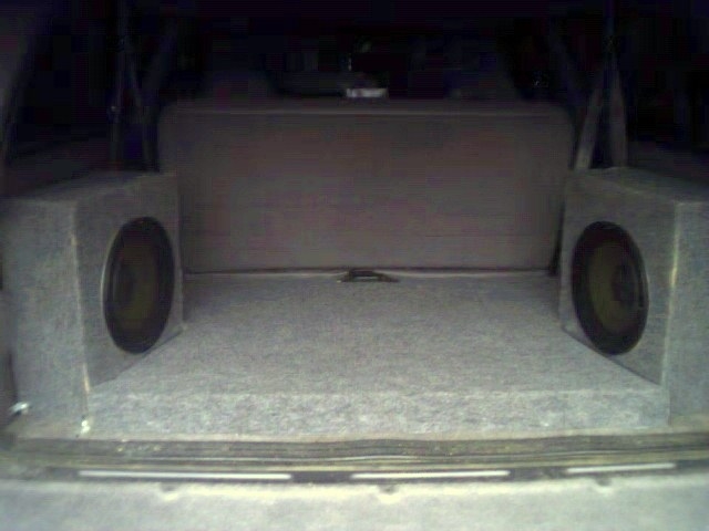 Here is the floor covering/amp boxes.  Cap mounted on back right speaker box.