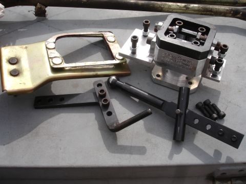 1995 Ford Taurus - A short shifter assembly and associated parts are laid out on a flat surface.