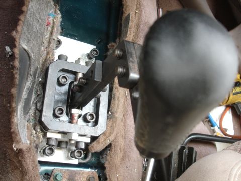 1995 Ford Taurus - Close-up of a modified short shifter mechanism in a vehicle's interior.