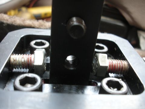 1995 Ford Taurus - Detail of a vehicle's short shifter mechanism, showing bolts and mounting hardware.