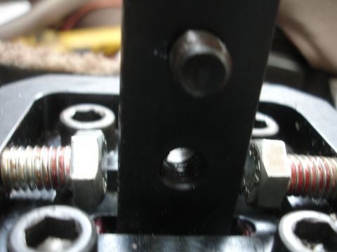 1995 Ford Taurus - Detail of a car's short shifter mechanism, showing bolts and mounting points.