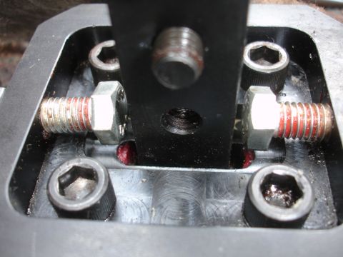 1995 Ford Taurus - A close-up view of a custom short shifter mechanism, showing bolts and red thread locker.