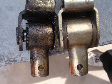 1995 Ford Taurus - Shifter cable ends shown for comparison, one heavily soiled with grease.